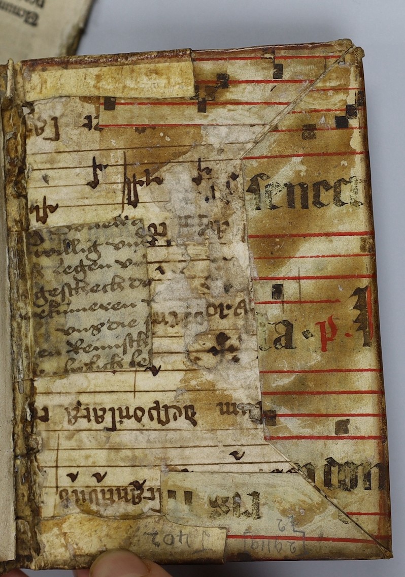 Savonarola, Girolamo, (De Simplicitate Christiane Vite). 48 (ex:60) ff., 3 decorated initial letters; bound in fragments of an old service book (with music notation), sm. 8vo. (Paris: in chalcographia Ascensiana, 1510)